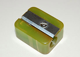 A green bakelite pencil sharpener